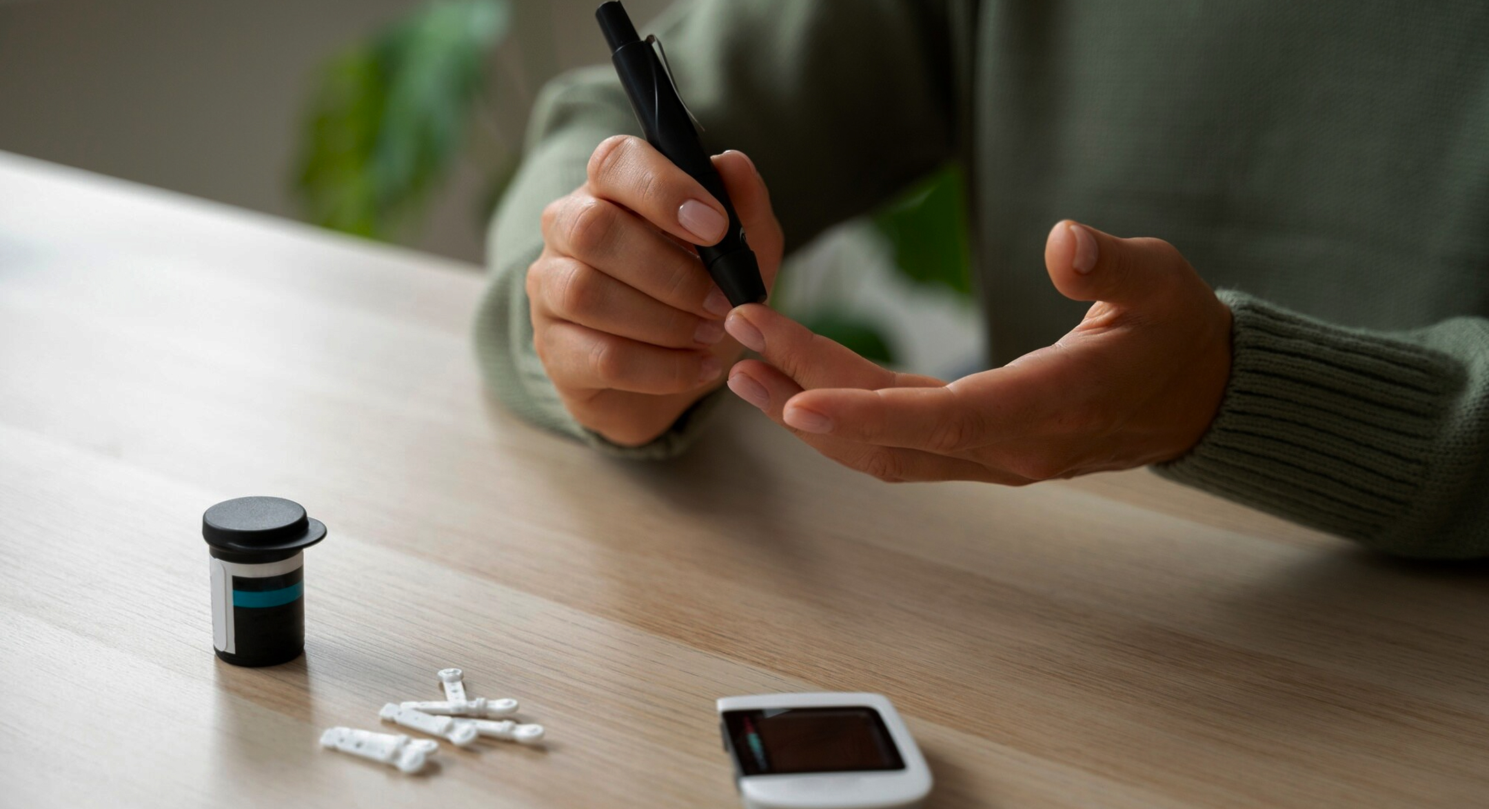 Finger prick blood sugar test for diabetes monitoring